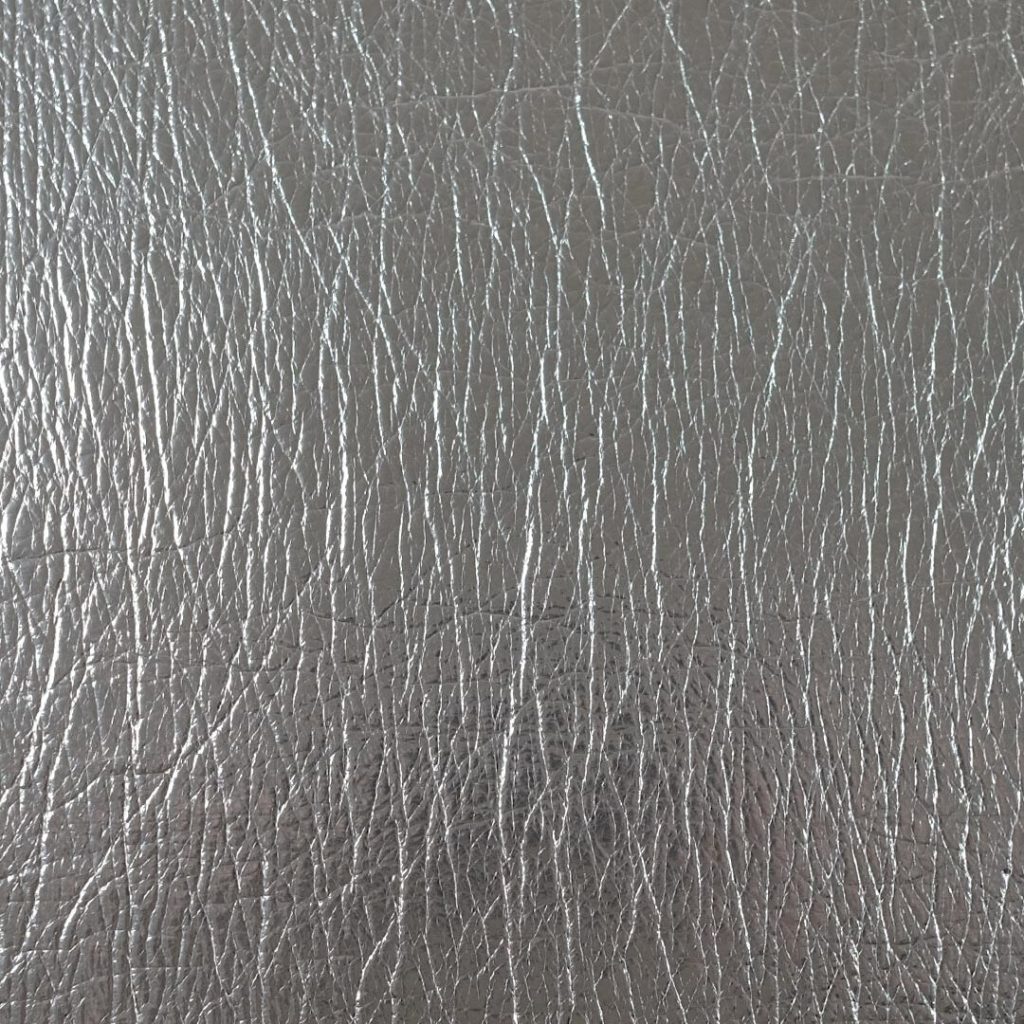 Close up of texture of PU material Flash Argento
