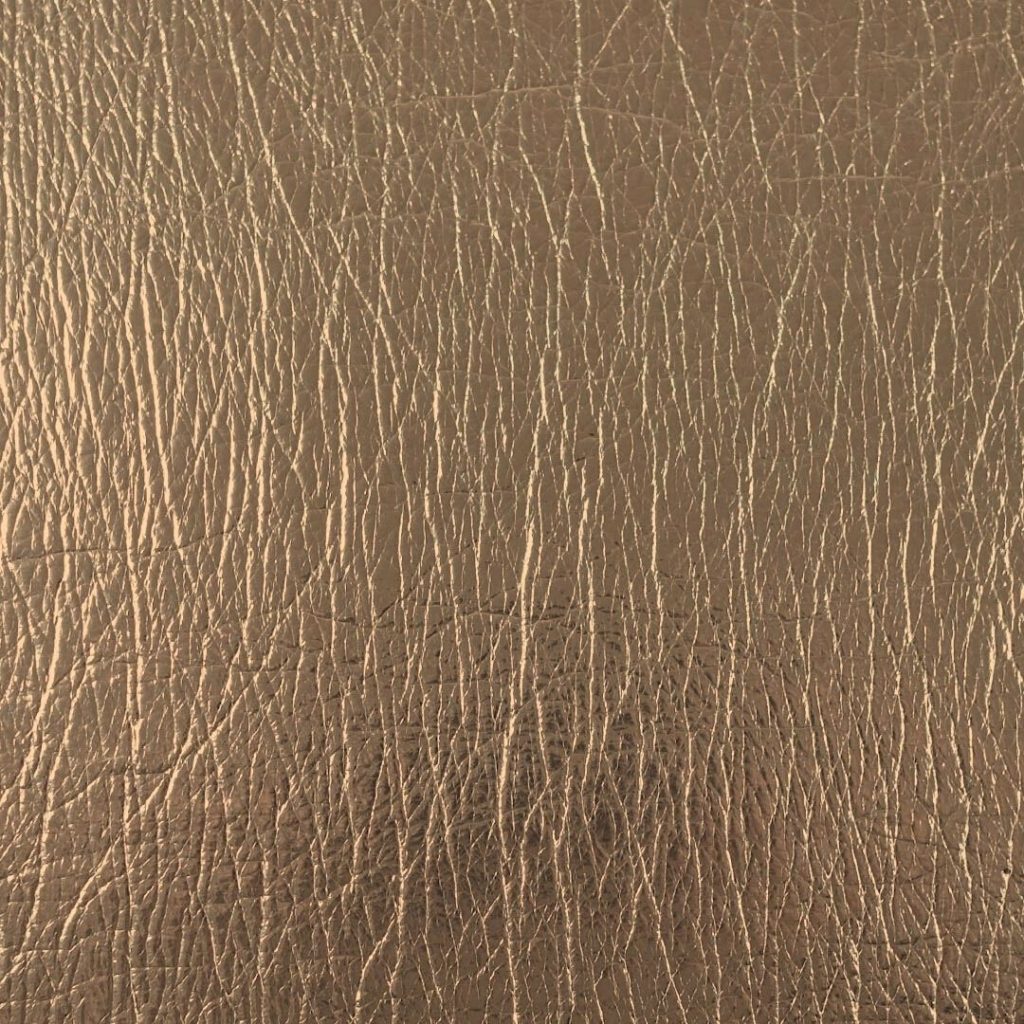 Close up of texture of PU material Flash Oro