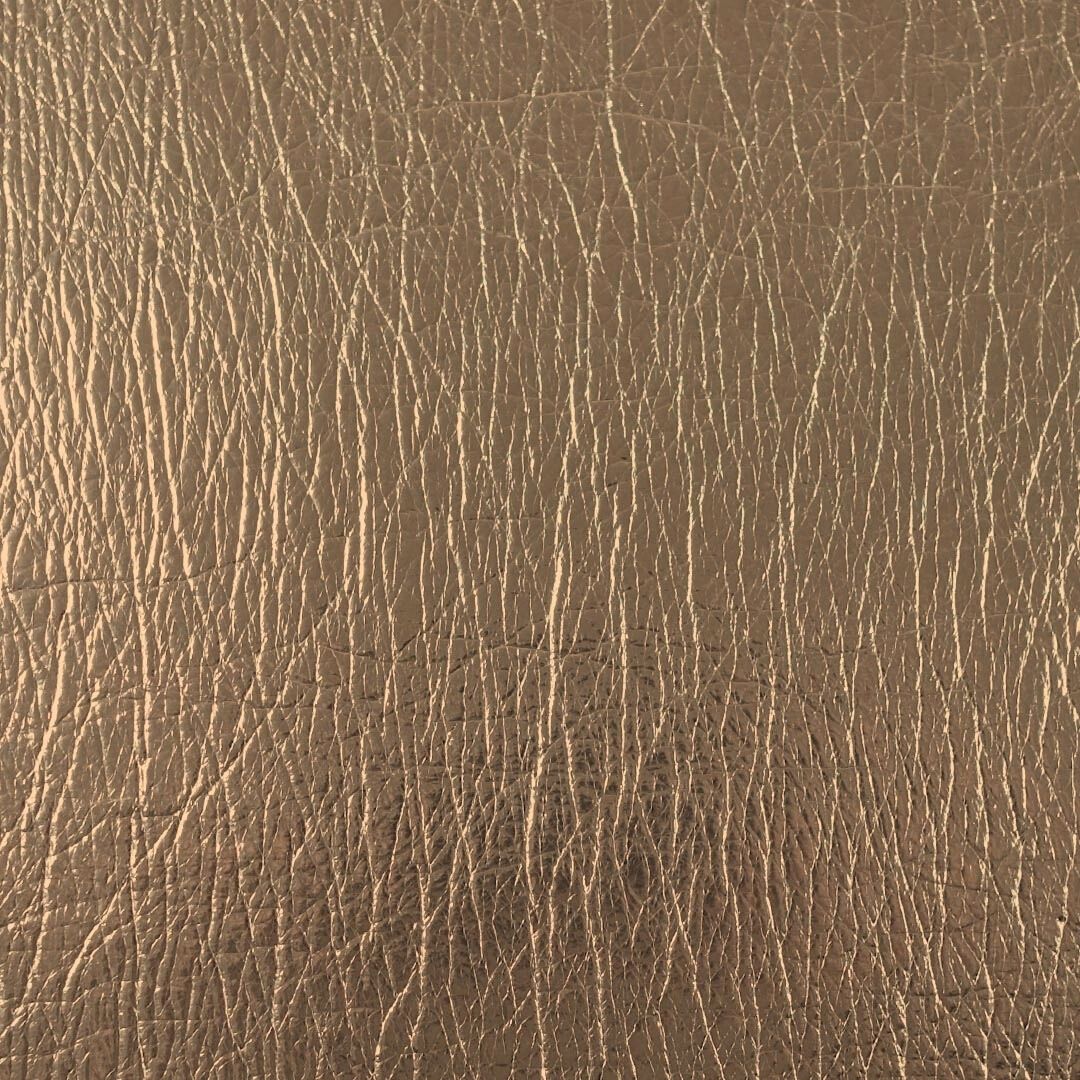 Close up of texture of PU material Flash Oro