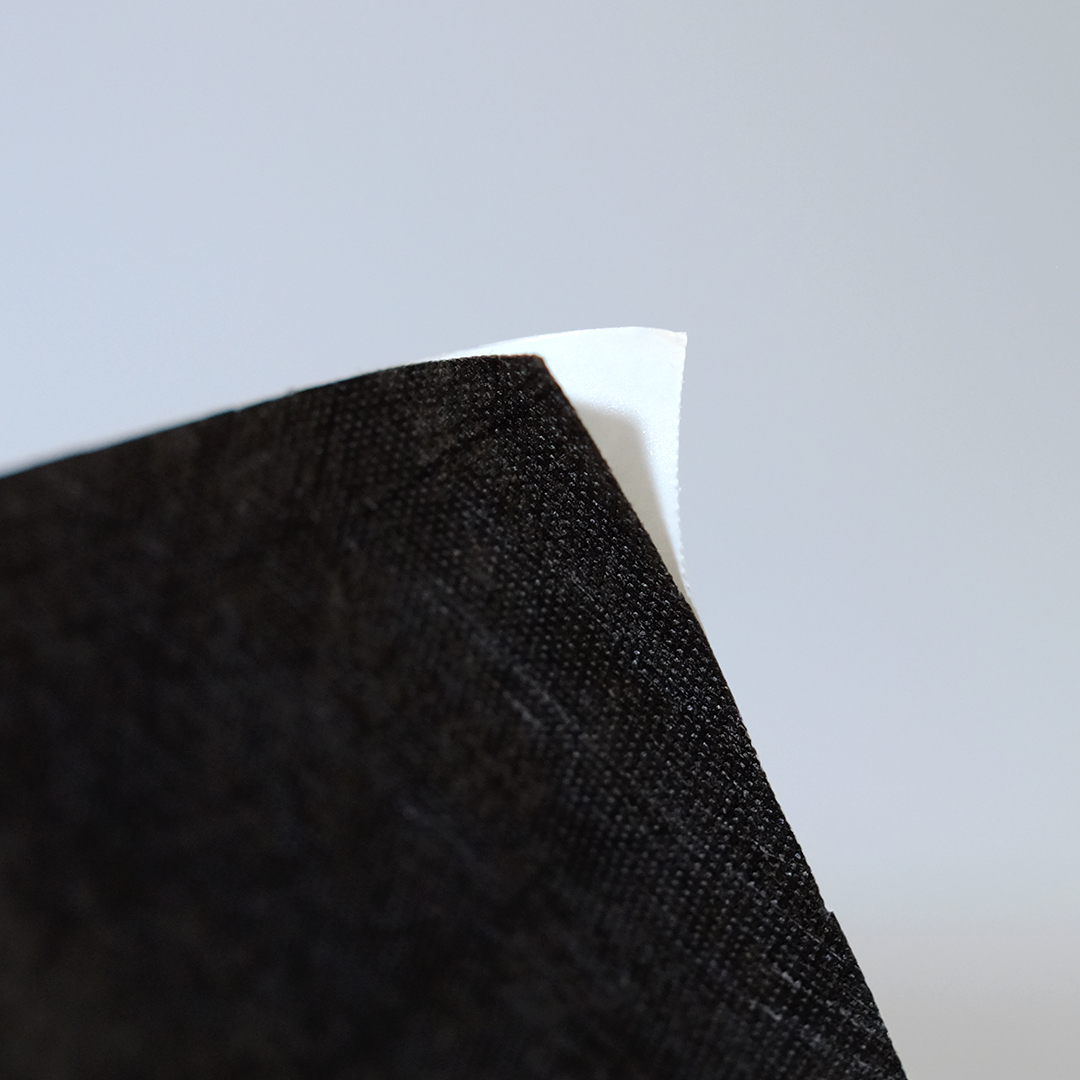 Close up of black self-adhesive non-woven.