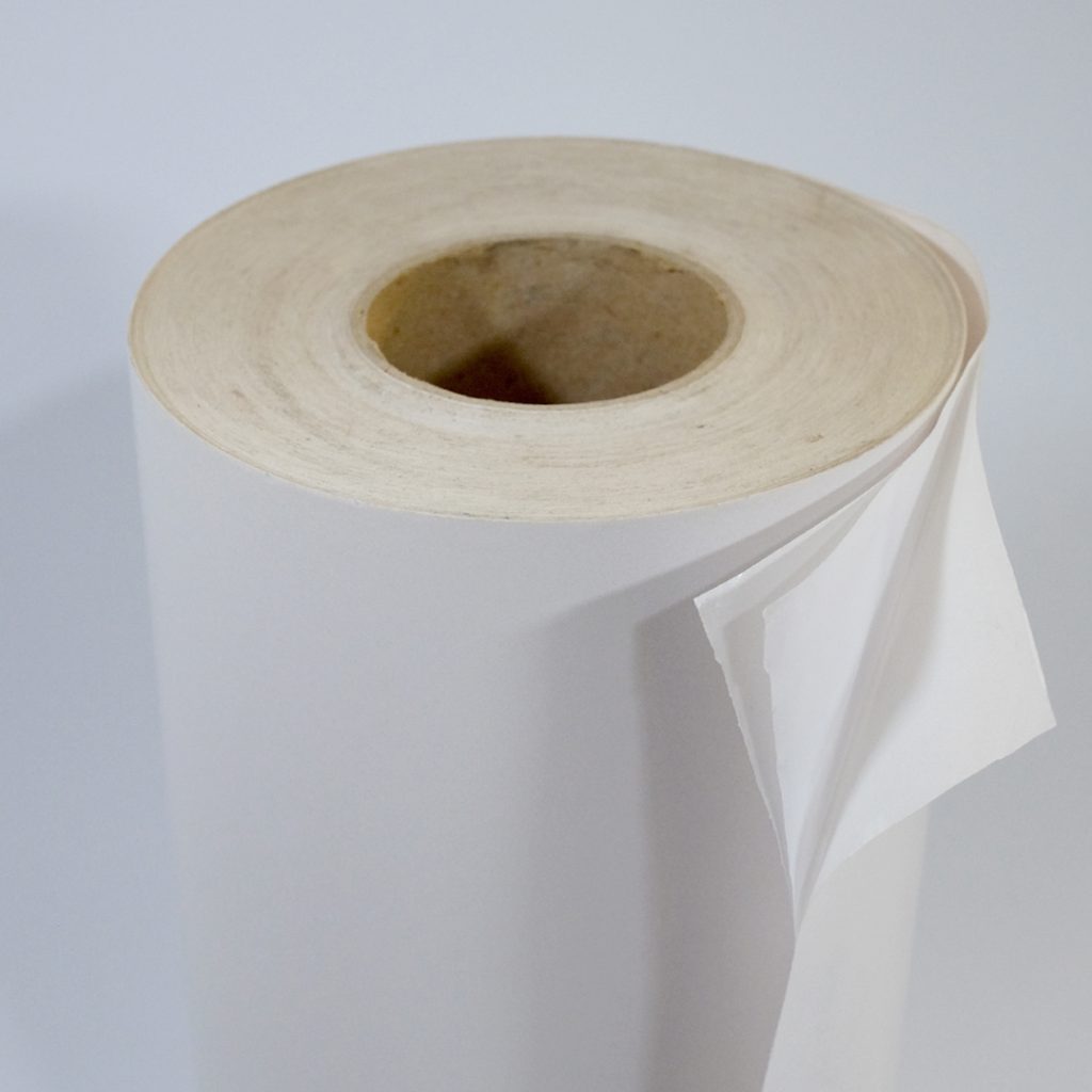 Close up of two-sided self-adhesive white paper