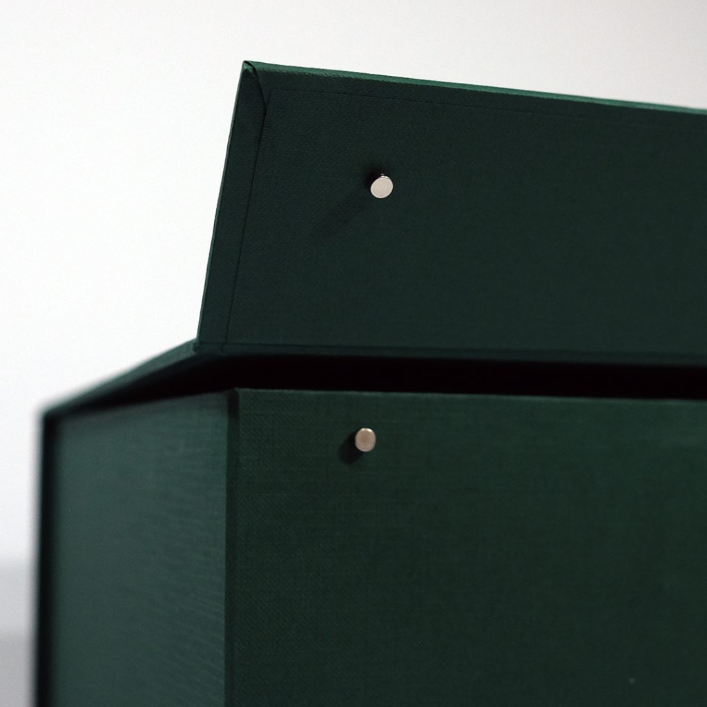 Close up of a magnet set being placed in a box.