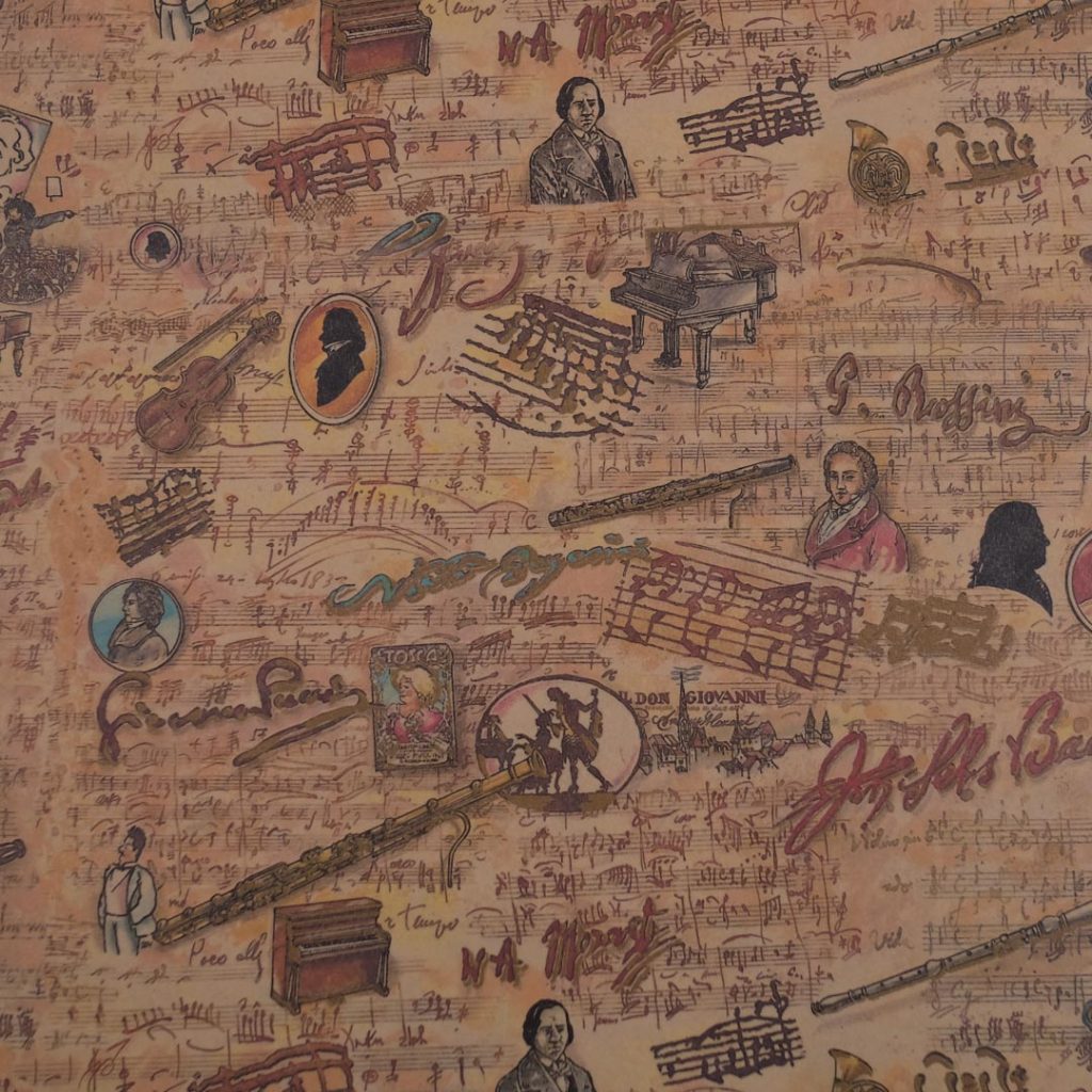 Close up of vintage printed musical-themed art paper.