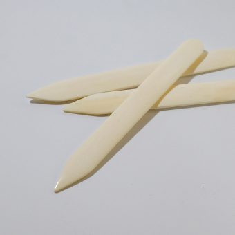 Close up of pointed bonefolders.