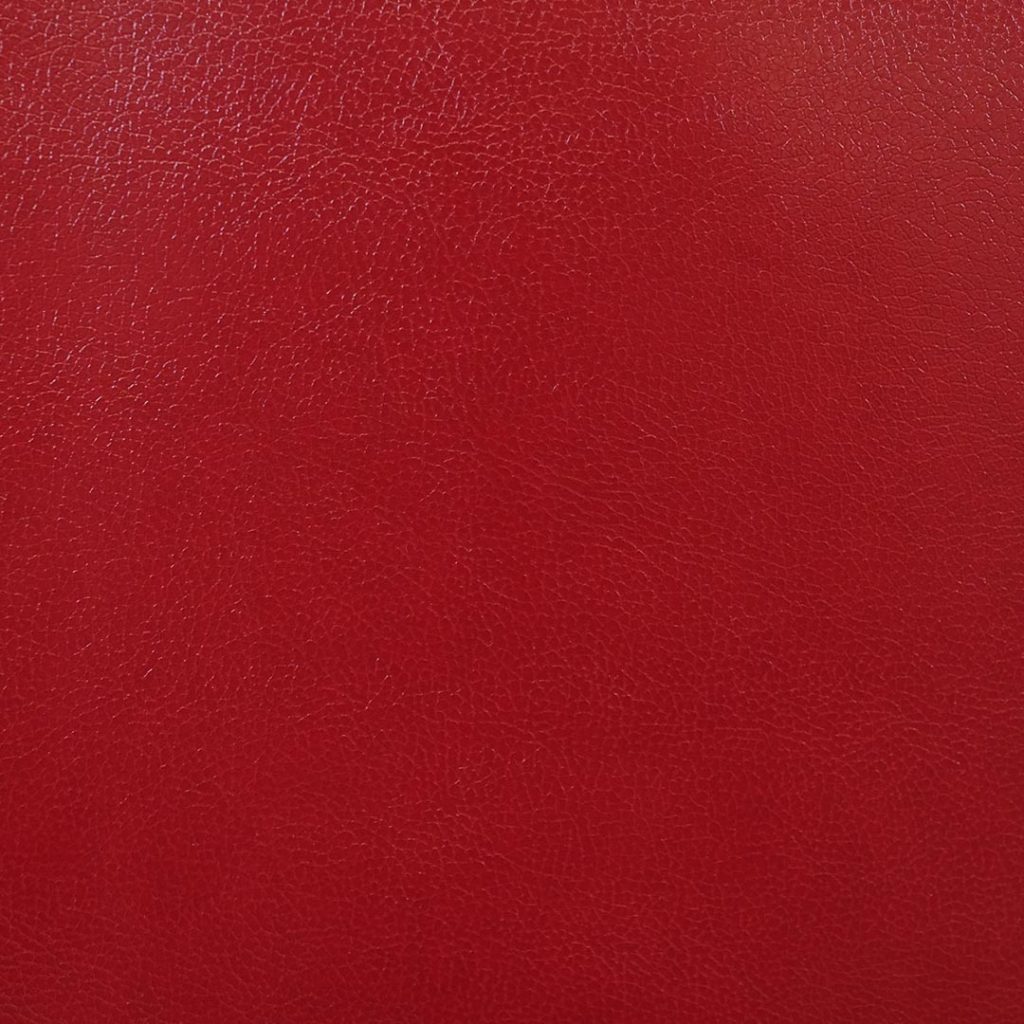Close up of texture of Figari 26121 Maroon PVC material.