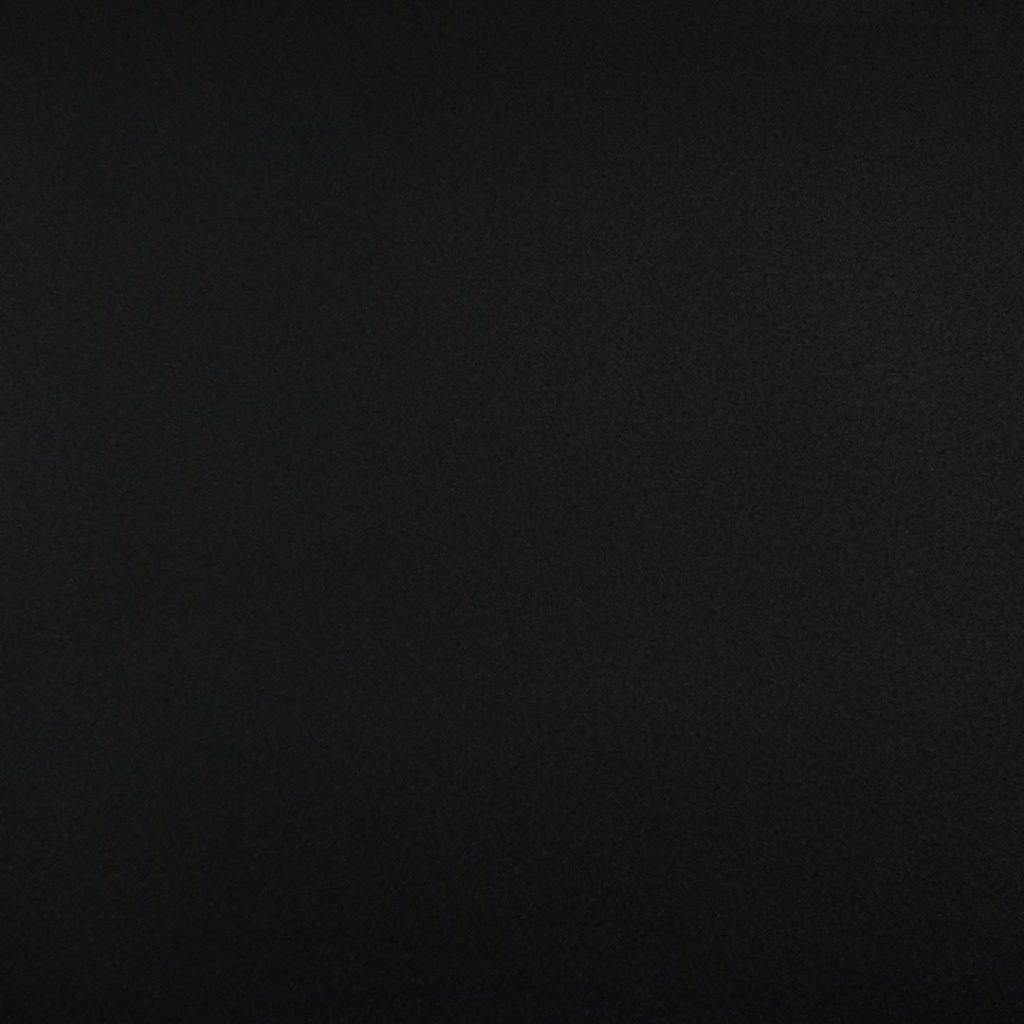 Close up of texture of Fluctuations 29401 Black PVC material.