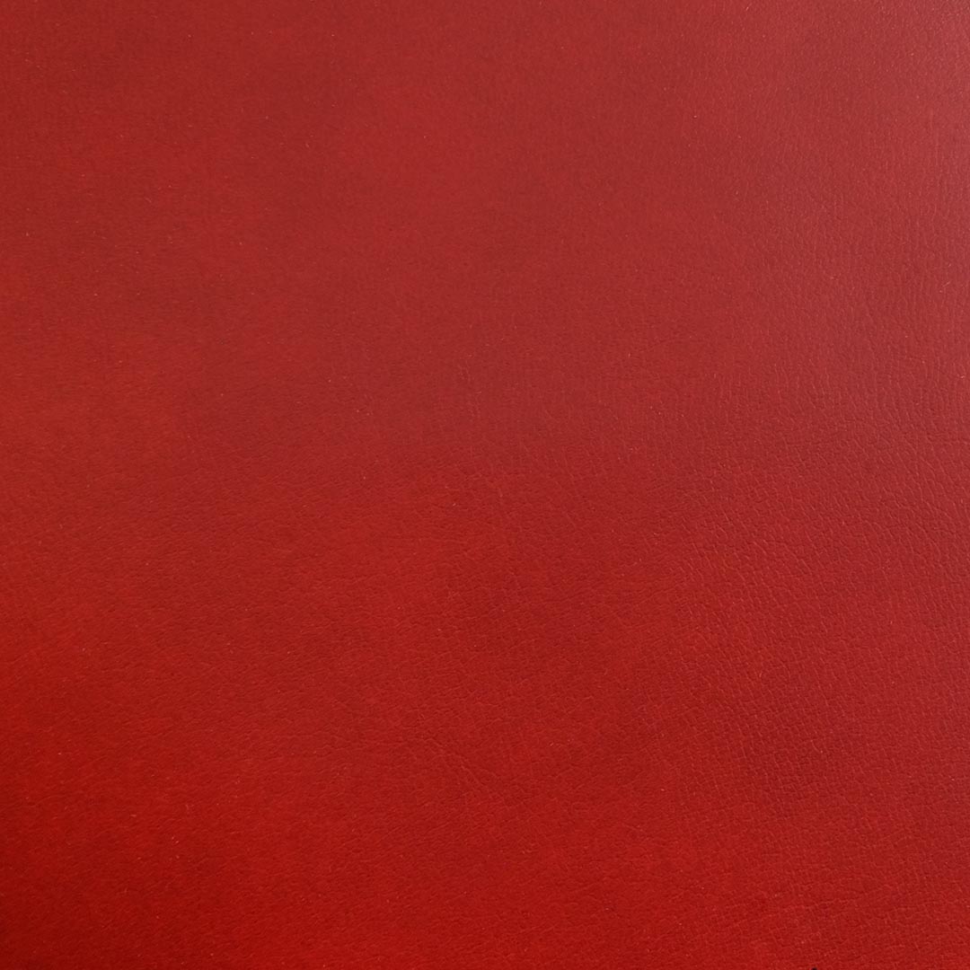 Close up of texture of Megara 24084 Red PVC material.
