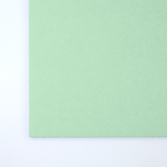 Close up of texture of a solid green paperboard.
