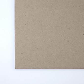 Close up of texture of a solid grey paperboard.