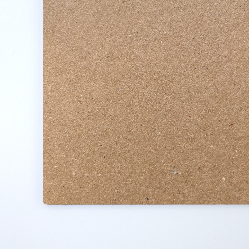 Close up of texture of a solid kraft paperboard.