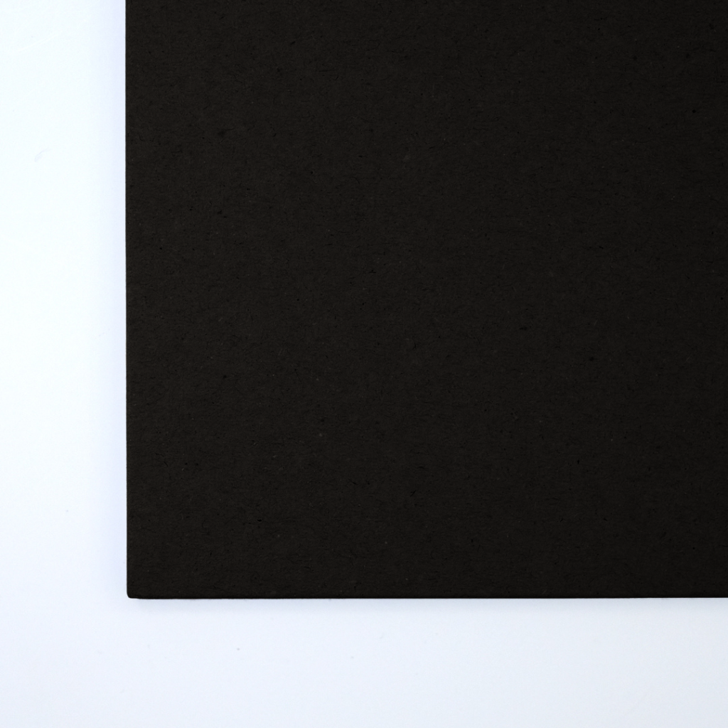 Close up of texture of a solid black paperboard.